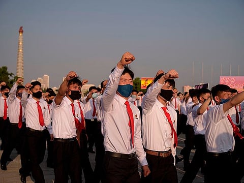 North Korean students take part in a rally denouncing 'defectors from the North' as they march from the Pyongyang Youth Park Open-Air Theatre to Kim Il Sung Square in Pyongyang on June 8, 2020.