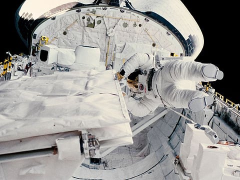 In an image provided by NASA, Kathy Sullivan during a space walk from the shuttle Challenger in 1984. On Sunday, June 7, 2020, Sullivan, 68, an astronaut and oceanographer, emerged from her 35,810-foot dive to the Challenger Deep, according to EYOS Expeditions, a company coordinating the logistics of the mission. 