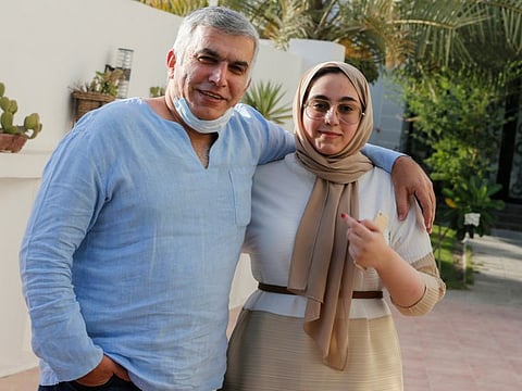 Nabeel Rajab and his daughter pose for a photo, after he was released, at his house in Budaiya in Manama, Bahrain June 9.