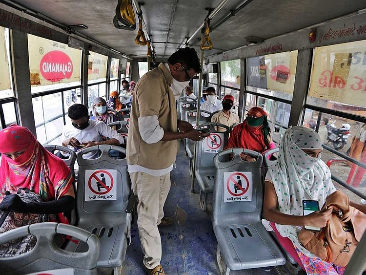 Passengers on a city bus in Ahmedabad, India