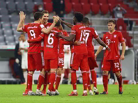 Bayern Munich's Robert Lewandowski celebrates scoring their second goal with teammates.