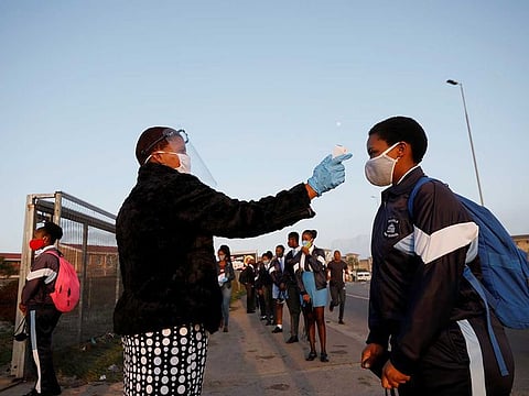 A student is screened as schools begin to reopen after the coronavirus disease (COVID-19) lockdown in Langa township in Cape Town, South Africa June 8, 2020. 