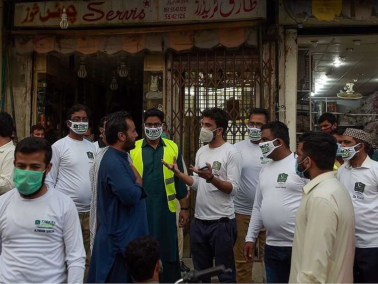 Members of Prime Minister Imran Khan's Corona Relief Tiger Force Pakistan
