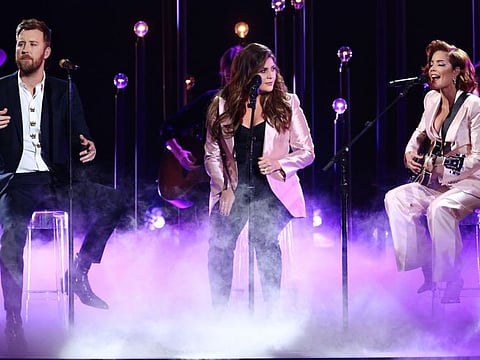 (FILES) In this file photo taken on November 13, 2019 (L-R) Charles Kelley and Hillary Scott of Lady Antebellum and Halsey perform onstage during the 53rd annual CMA Awards at the Bridgestone Arena in Nashville, Tennessee.  The Grammy-winning country group formerly known as Lady Antebellum on June 11, 2020, announced their new name Lady A, with members saying they were "embarrassed" for not considering the band name's link to slavery. The term "antebellum" refers to a time period before a war, and is widely associated with the pro-slavery American South in the pre-Civil War years.
 - -- IMAGE RESTRICTED TO EDITORIAL USE - STRICTLY NO COMMERCIAL USE --
 / AFP / GETTY IMAGES NORTH AMERICA / Terry Wyatt / -- IMAGE RESTRICTED TO EDITORIAL USE - STRICTLY NO COMMERCIAL USE --