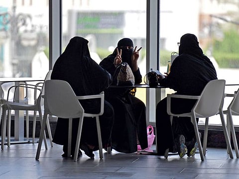 Women sit at a cafe in a shopping mall in the Saudi capital of Riyadh on June 4, 2020.