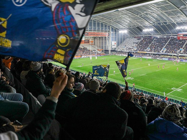 Spectators watch the Super Rugby Aotearoa rugby game between the Highlanders and Chiefs in Dunedin
