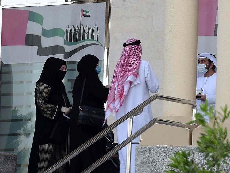 Dubai Court employees are seen at their office premises.