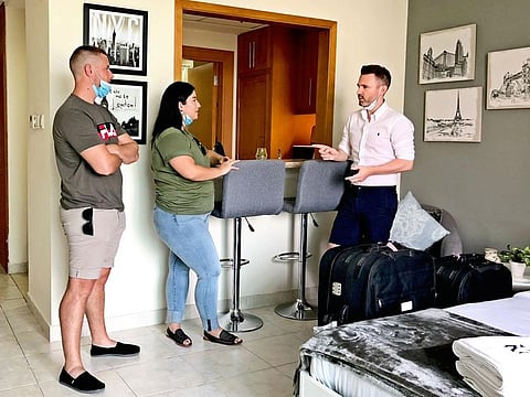Dean Theron and Blanca Mandujano with Simon Kennedy inside their new apartment