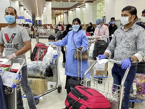 Kochi: Passengers arrive via Air India flight at Kochi International Airport, as part of an evacuation operation due to closure of commercial air services amid the ongoing coronavirus pandemic, in Kochi, Wednesday, June 10, 2020. (PTI Photo)(PTI10-06-2020_000237B)