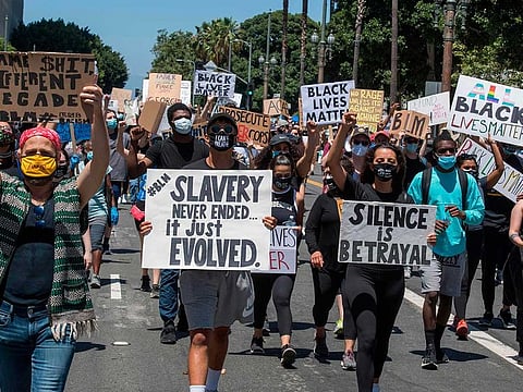 Social workers join Black Lives Matter members during a demonstration against racism and police brutality, outside City Hall in Los Angeles, California on June 13, 2020.   Demonstrations are being held across the US following the death of George Floyd on May 25, 2020, while being arrested in Minneapolis, Minnesota.