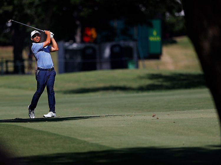 Xander Schauffele of the United States plays a shot on the 17th hole during the third round of the Charles Schwab Challenge