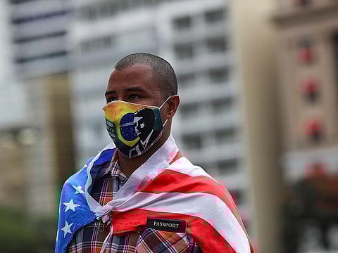 A protester wearing a protective face mask takes part in a demonstration in support of Brazil's President Jair Bolsonaro in Sao Paulo, Brazil, June 14, 2020. 