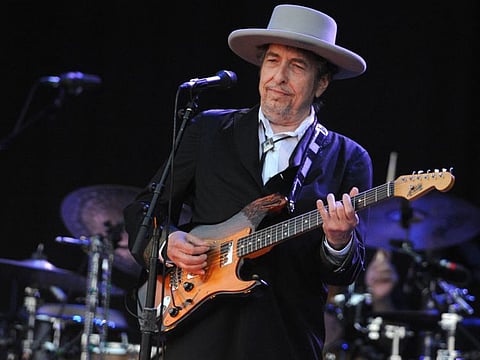 In this file photo taken on July 22, 2012 Bob Dylan performs on stage during the 21st edition of the Vieilles Charrues music festival in Carhaix-Plouguer, western France.