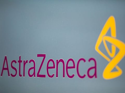 A sign featuring the AstraZeneca Plc logo stands at the company's DaVinci building at the Melbourn Science Park in Cambridge, UK.