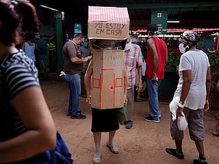 Cuban dons full-body cardboard shield against coronavirus