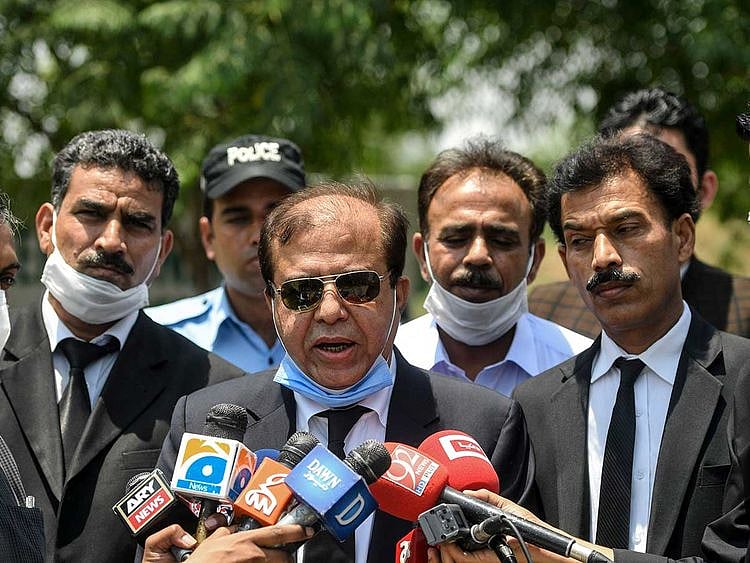 Khawaja Imtiaz (C), a special public prosecutor for the 2010 murder case of influential Pakistani politician Imran Farooq in London