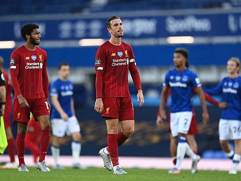 Liverpool’s Jordan Henderson leaves the field at the end of the Premier League match against Everton on Sunday, June 21, 2020. 
