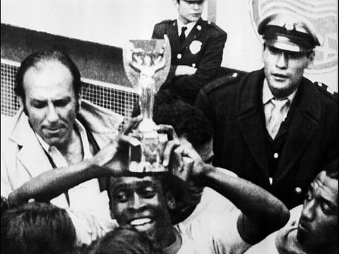 Pele holds aloft with the Jules Rimet Trophy after Brazil turned in a majestic performance to win the 1970 Fifa World Cup. The signature trophy was handed over to the Latin Americans for winning the title thrice.