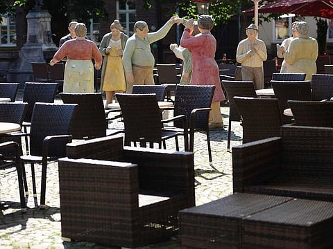 Sculptures stand at a restaurant in the city of Rheda-Wiedenbrueck, western Germany on June 23, 2020. After a coronavirus outbreak at a slaughterhouse in the town of Rheda-Wiedenbrueck that has infected more than 1,500 workers out of a total of nearly 7,000 German authorities ordered a new lockdown for an entire district - the first since easing coronavirus restrictions and a major setback for hopes of a swift return to normality. 