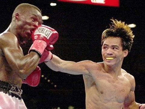 A young Manny Pacquiao (right) lands a vicious hook at IBF super-bantamweight champ Lehlo Ledwaba of South Africa during his first career win on this day 19 years ago.