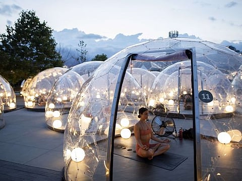 COVID-19 impact: Outdoor yoga in bubble pods in Canada