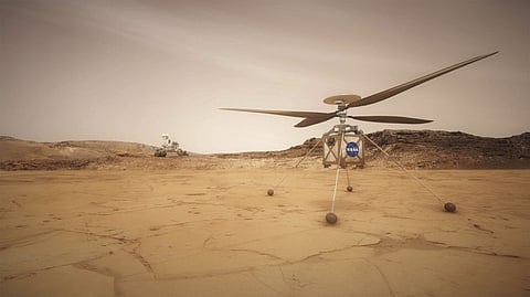 In an undated photo from JPL-Caltech/NASA, an artist's rendering of the Mars helicopter, Ingenuity, right, and the rover, Perseverance, left, on the surface of Mars. As part of its next Mars mission, NASA is sending an experimental helicopter to fly through the red planet’s thin atmosphere. 