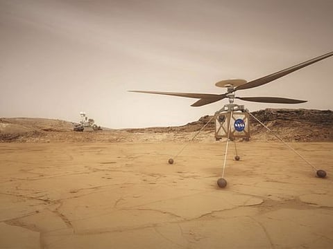 In an undated photo from JPL-Caltech/NASA, an artist's rendering of the Mars helicopter, Ingenuity, right, and the rover, Perseverance, left, on the surface of Mars. As part of its next Mars mission, NASA is sending an experimental helicopter to fly through the red planet’s thin atmosphere. 