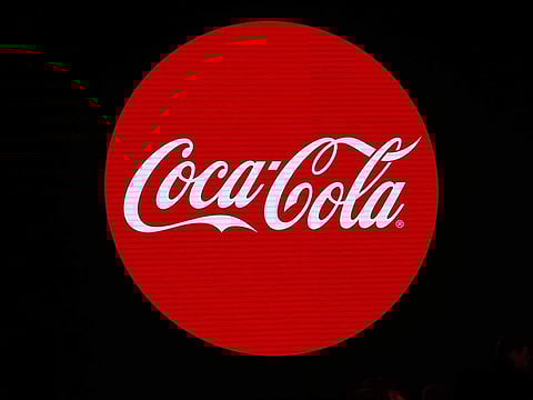 This file photo taken on January 19, 2016 shows the logo of the Coca-Cola company during the presentation of a new advertising campaign in Paris. 
