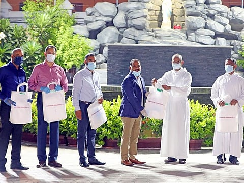Exemplary philanthropic gesture by  the St.Mary's Catholic Church Dubai, sponsoring the PPE kit to the passengers of the first Chartered flight organized by the Catholic Congress UAE. Mr. Benny Mathew Pulickekara President Catholic Congress UAE receiving the PPE kit and blessings from the Parish Priest Fr.Lennie J Connully and Asst. Parish Priest Fr. Alex Vachaparambil. General Secretary Renjith Joseph, Vice President Rajeev Abraham, Treasurer Majo Antony and Project Coordinator Santhosh Mathew were also present.