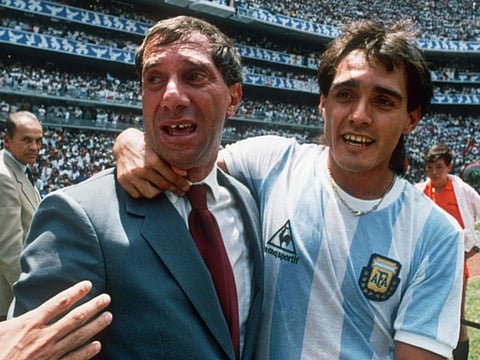Argentina's Pedro Pasculli celebrates with coach Carlos Bilardo after Argentina beat West Germany 3-2 in the World Cup final in Mexico City.