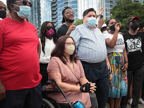 Senator Tammy Duckworth participates with Illinois Governor J.B. Pritzker in a Juneteenth march organised by faith leaders on June 19, 2020 in Chicago, Illinois. 