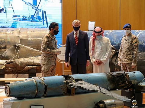 Saudi Arabia's Minister of State for Foreign Affairs Adel Al Jubeir and US Special Representative for Iran Brian Hook, check the display of the debris of ballistic missiles and weapons which were launched towards Riyadh, in the Saudi capital on June 29.