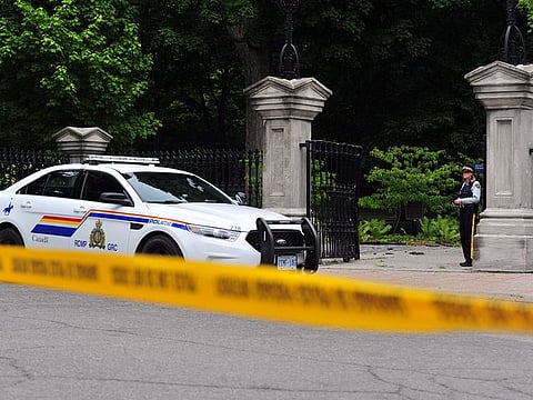 Canadian police stand guard outside Rideau Hall in Ottawa, Canada on July 2, 2020, after an armed man who entered the grounds was arrested in the property that is home to Prime Minister Justin Trudeau and the country's governor general.