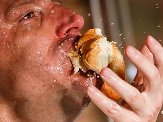 Photos: Hot dog champs repeat as July 4 gluttony fest moves indoors