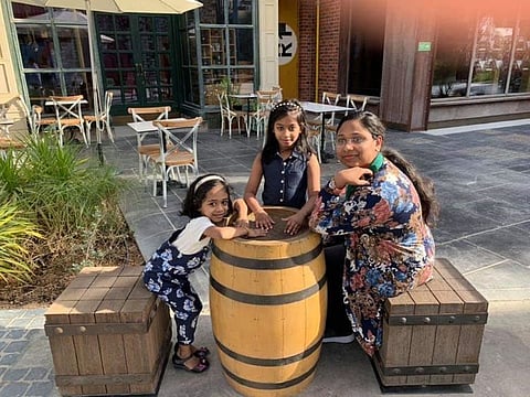 Akhila Shinu with her daughters Maria and Anna.