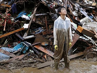 Japan battered by more heavy rain, floods, nearly 60 dead