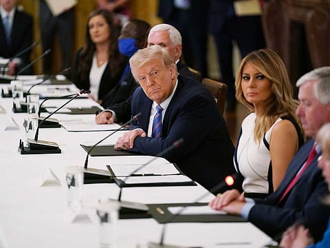 President Donald Trump and first lady Melania Trump at a discussion, that also included Education Secretary Betsy DeVos, about safely reopening America's schools in the face of the coronavirus pandemic, at the White House in Washington, July 7, 2020. 