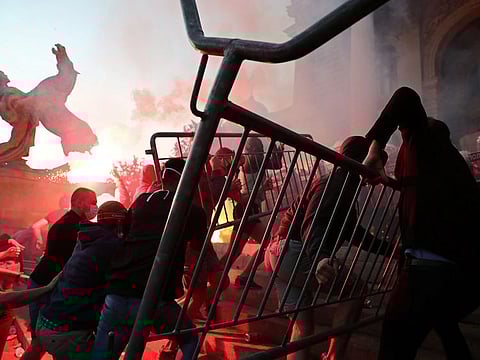 Demonstrators clash with police officers during an anti-government rally, amid the spread of the coronavirus disease (COVID-19), in front of the parliament building in Belgrade, Serbia, July 8, 2020.