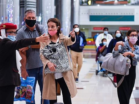Passengers arriving at Terminal 3, Dubai International Airport, on Wednesday as Dubai reopens to tourists 