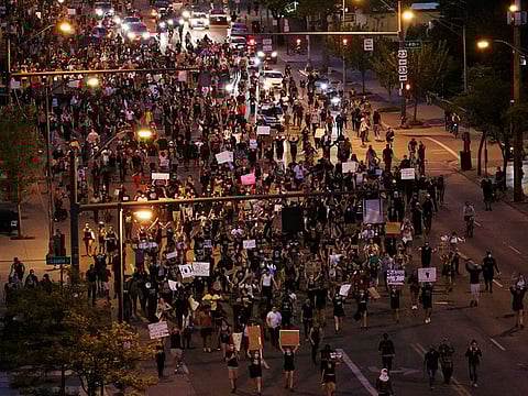 In this file photo from June 2, 2020, protesters march west on Broad Street in Columbus, Ohio protesting the death of George Floyd in Minneapolis.