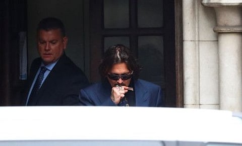 Actor Johnny Depp leaves the High Court in London, Britain, July 9.