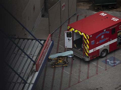 An ambulance sits outside the emergency room at Houston Methodist Hospital in the Texas Medical Centre in Houston on July 6, 2020. Intensive Care Units are reaching capacity. Nurses are falling sick, contributing to shortages. The new coronavirus spikes are challenging hospitals across the US.
