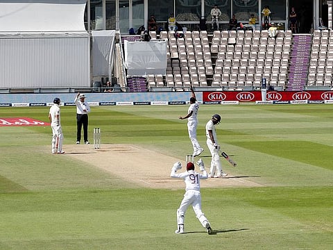 West Indies' Shannon Gabriel takes the wicket of England's Jofra Archer, during the fifth day of the first cricket Test, at the Ageas Bowl in Southampton, Saturday, July 11, 2020. 