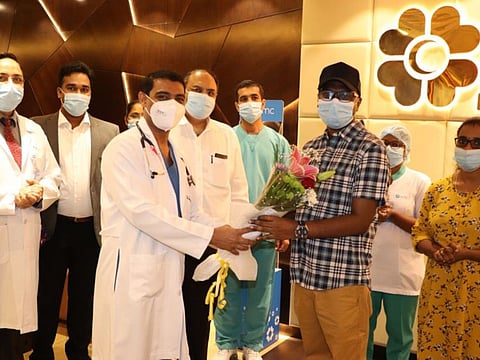 Dr. Srinivas Rao and his team of doctors who save Anu Mohanan. Anu is seen with his wife.