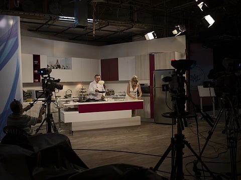 Chef Antoine El Hajj demonstrates recipes with affordable ingredients on a TV show in Beirut, July 7, 2020. Lebanon’s crisis, the result of years of government corruption and financial mismanagement, has caused unemployment and poverty rates to skyrocket, businesses to shutter, and salaries to lose their value as inflation soars. 