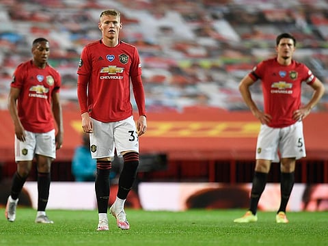 Manchester United’s players react after conceding a late equaliser against Southampton.