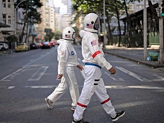 Brazilian couple wear 'spacesuits' to fight COVID-19