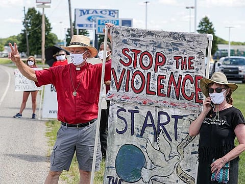 Protesters against the death penalty gather in Terre Haute, Ind., Monday, July 13, 2020. Daniel Lewis Lee, a convicted killer, was executed in the federal prison in Terre Haute. He was convicted in Arkansas of the 1996 killings of gun dealer William Mueller, his wife, Nancy, and her 8-year-old daughter, Sarah Powell.