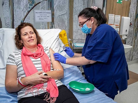 A volunteer is seen during a coronavirus disease (COVID-19) vaccine development announcement, made by the University of Queensland, in Brisbane, Australia, July 13, 2020. 