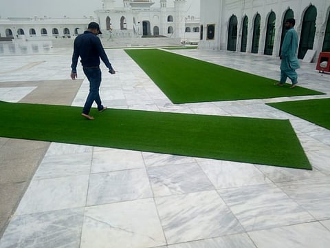 For the facilitation of Sangat during harsh weather conditions, Astroturf is being spread out at Gurdwara Darbar Sahib Kartarpur. 